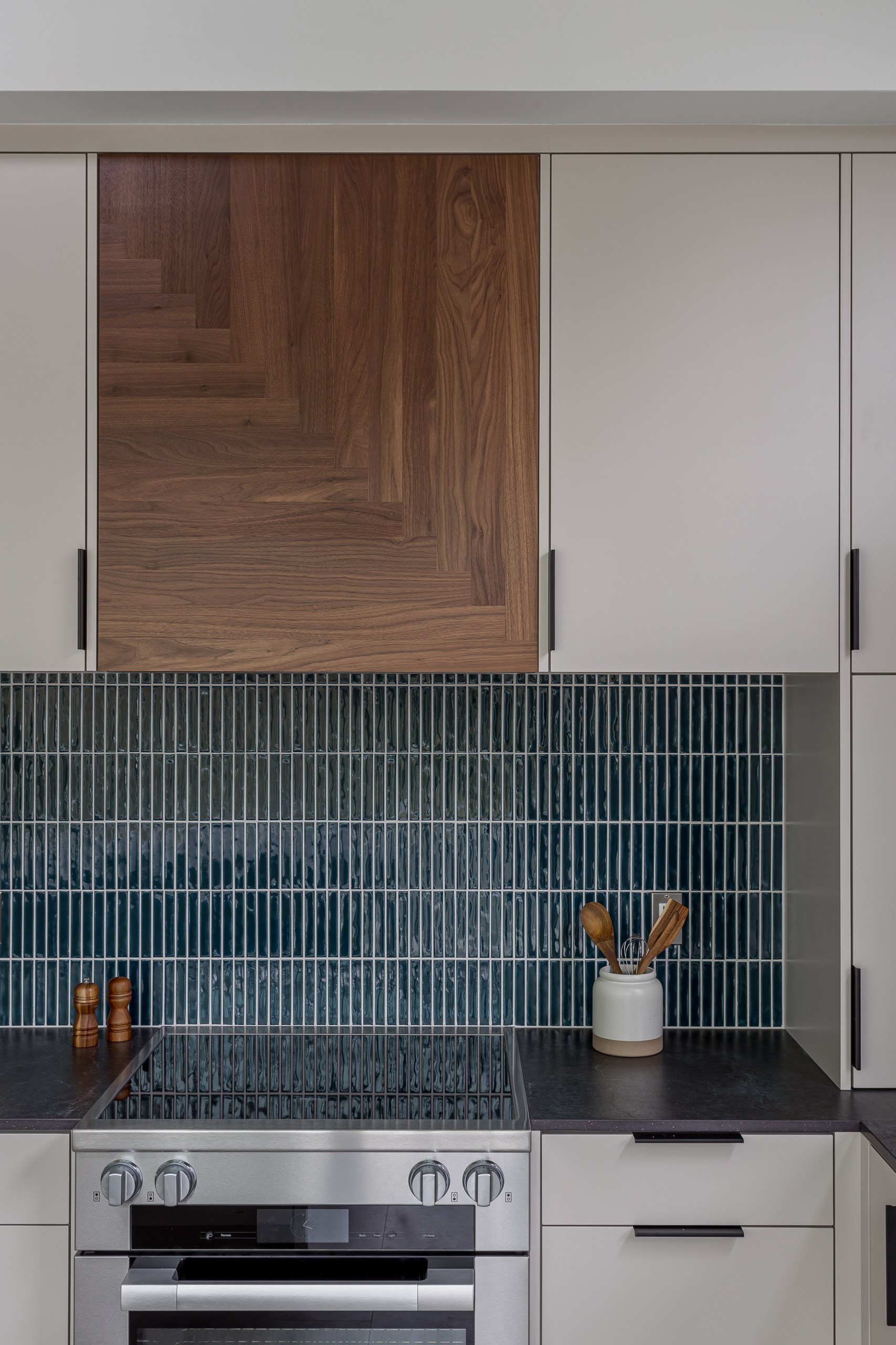Mid century kitchen with walnut accent hood