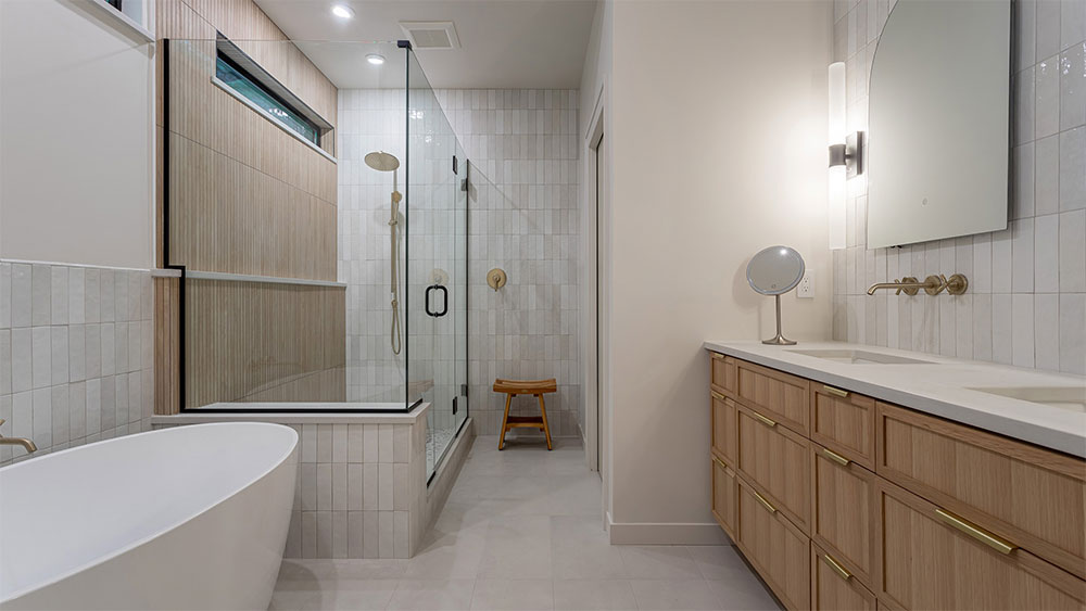 Amazing custom bathroom with floor to ceiling tile high end finishes in the countertops, cabinets, and hardware